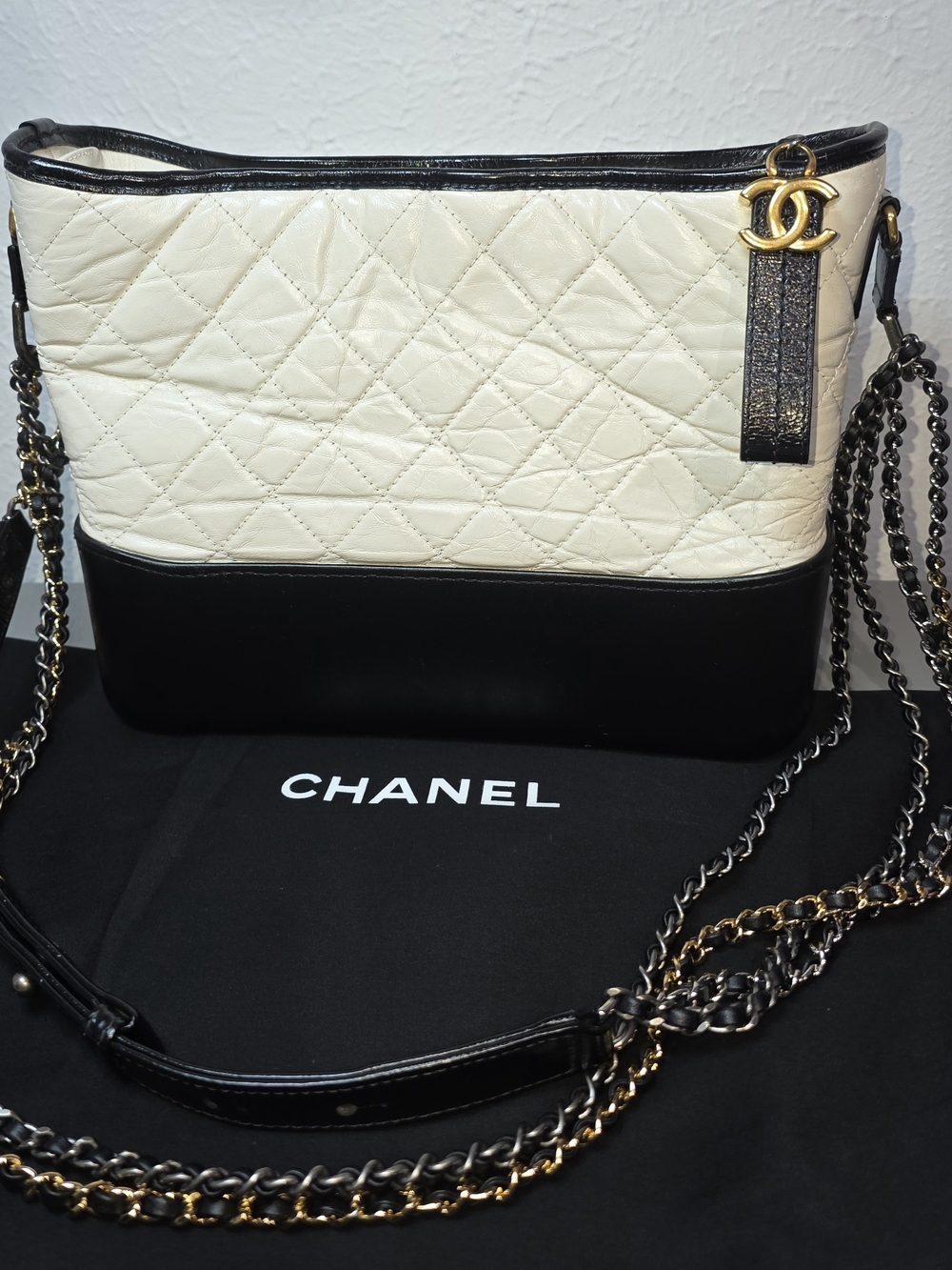 CHANEL Two-Tone Quilted Leather Hobo Bag in Black and Cream